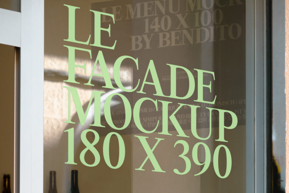 Shop window mockup with green sans serif text displayed on glass panel in daylight