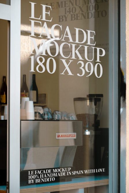 Shop window mockup with white text on glass overlooking cafe bar counter with bottles