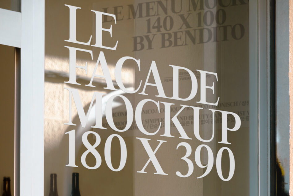 Shop window mockup with white serif text displayed on glass panel in daylight