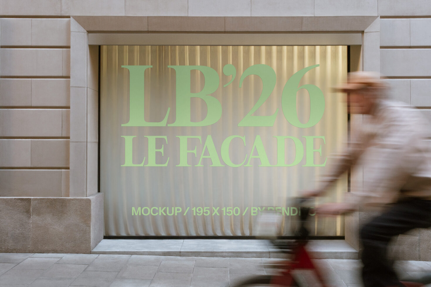 Large storefront window with green serif lettering glowing in interior