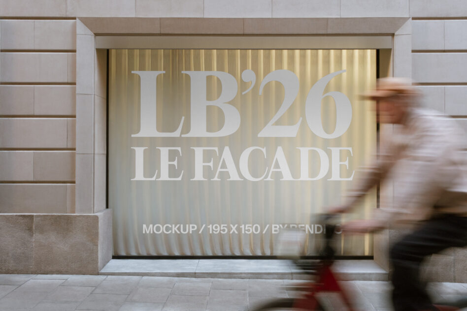 Storefront window display with cream text reading LB'26 LE FACADE on golden rippled backdrop