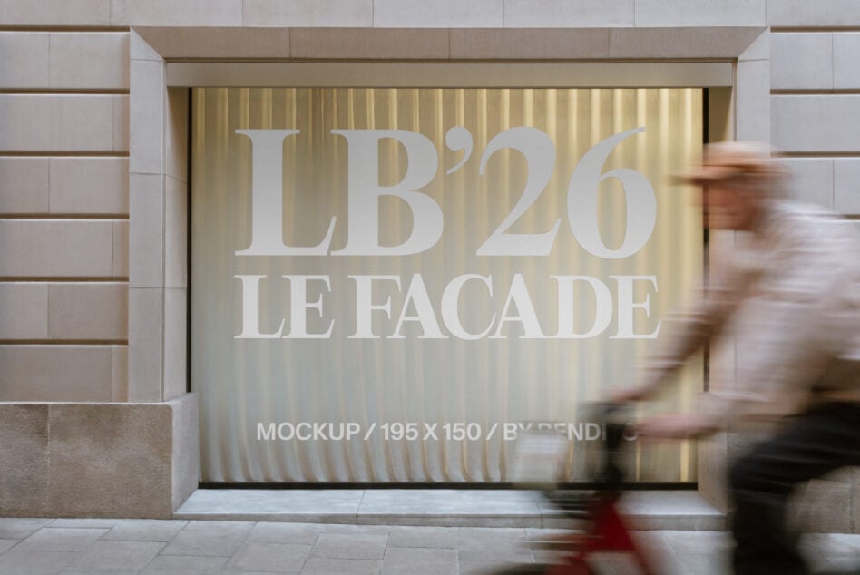 Storefront window display with cream text reading LB'26 LE FACADE on golden rippled backdrop