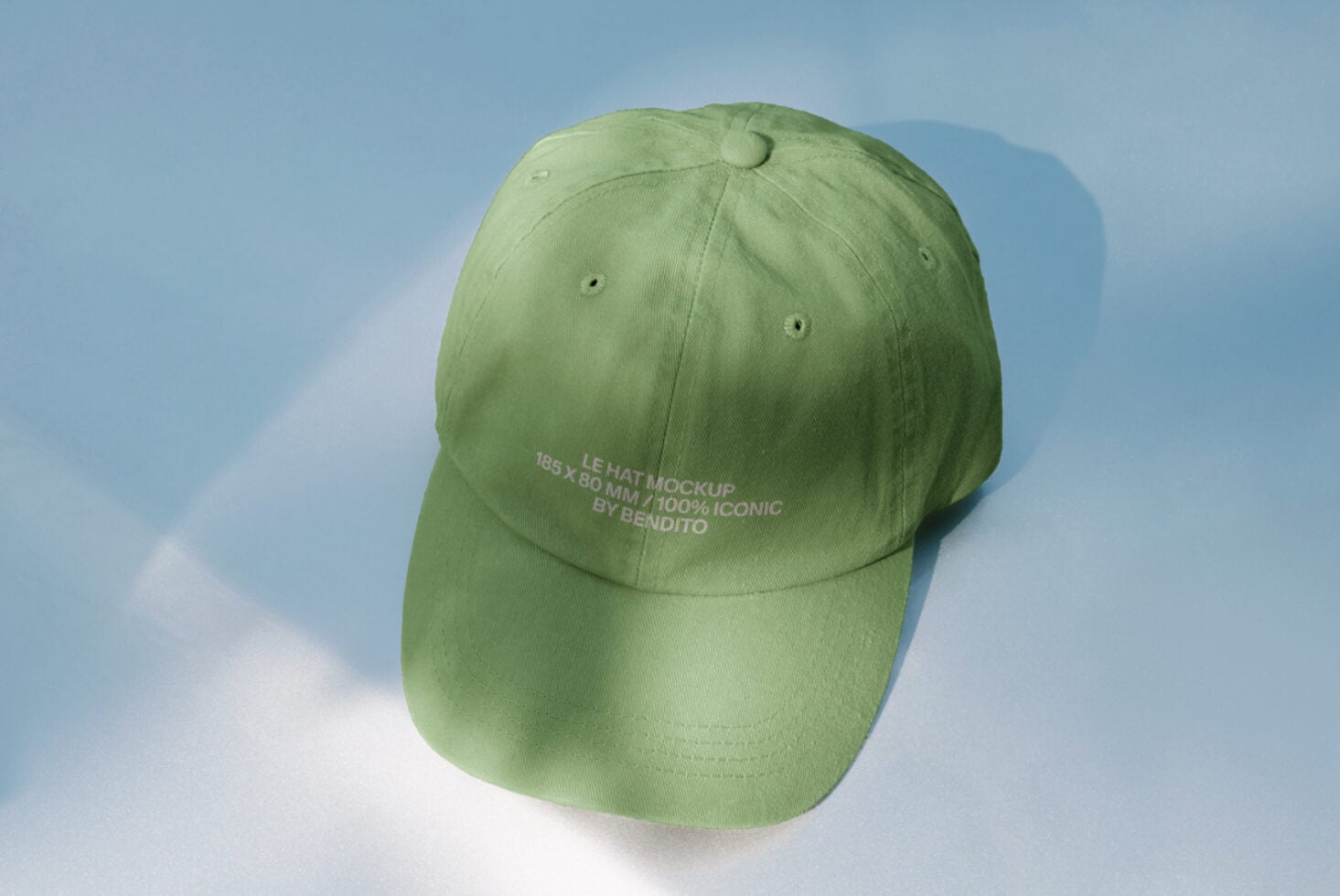 Pale green cap shot from above on sunny white ground