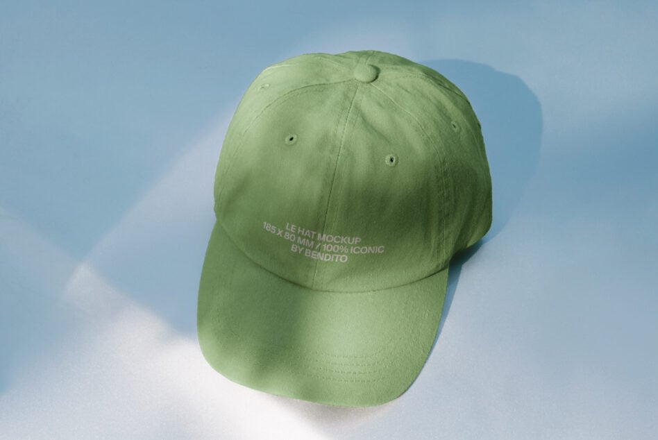 Pale green cap shot from above on sunny white ground