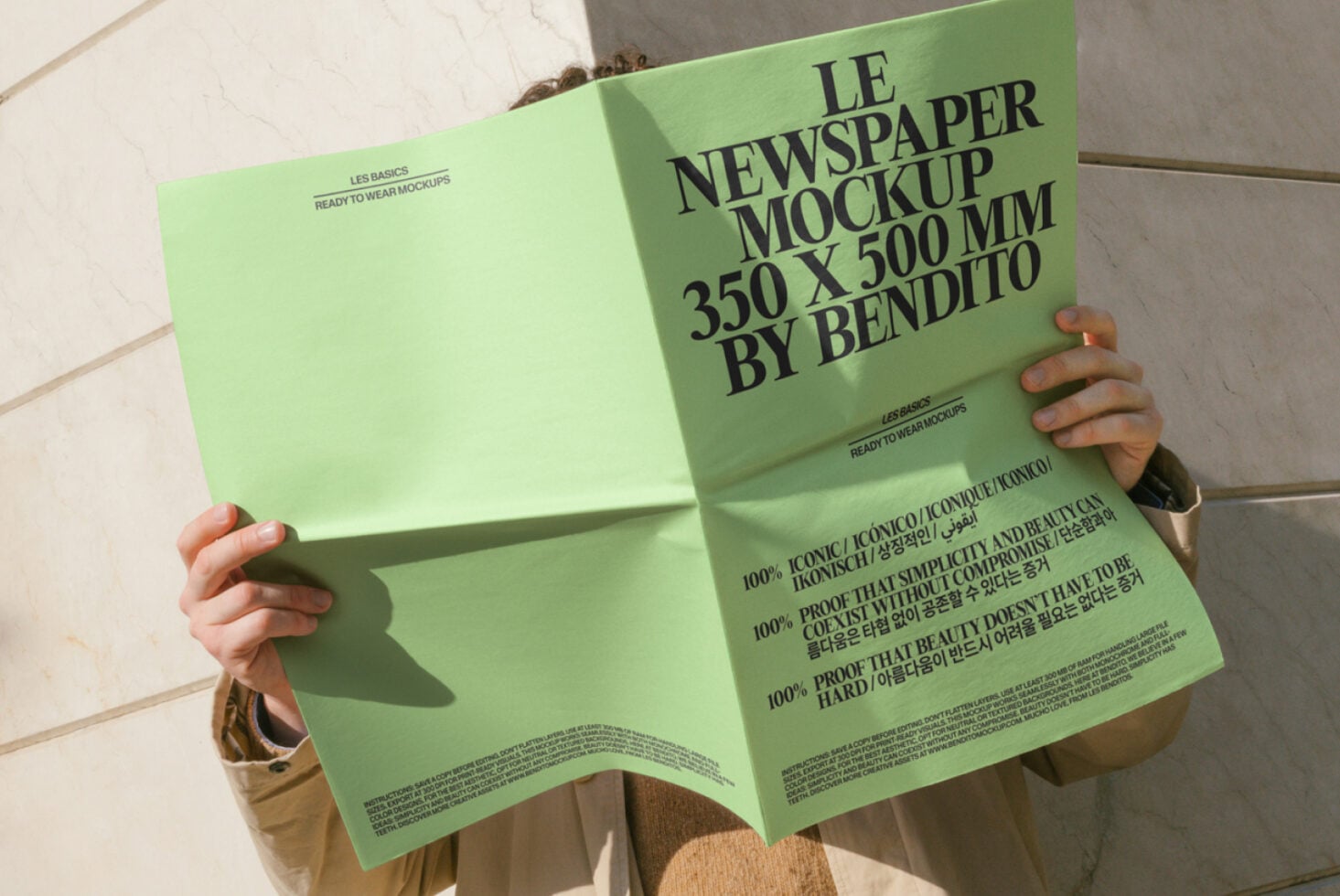 Spread of lime green newspaper mockup held open, vibrant color with small text detail