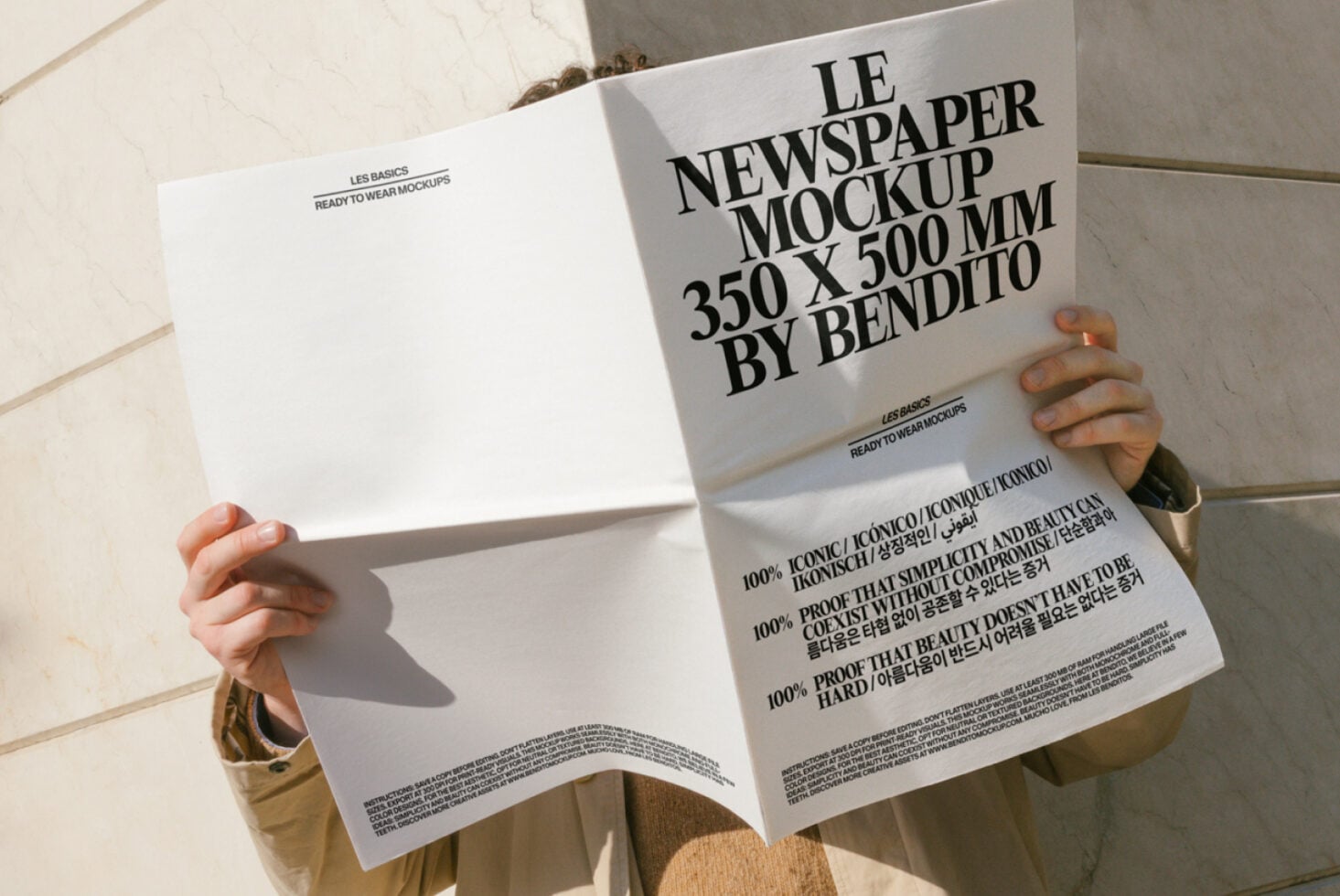 White newspaper mockup pages spread open, neutral tone with typography detail
