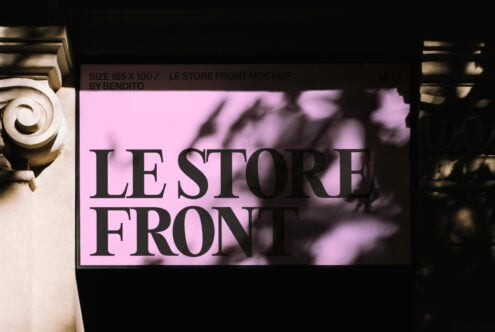 Pink storefront sign mockup with bold serif lettering, shadow overlay effect