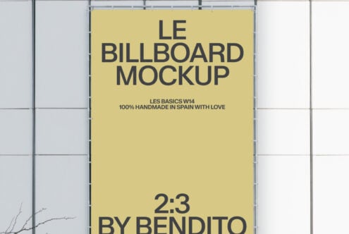 Yellow 2:3 scale billboard mockup clipped to metal grid storefront structure