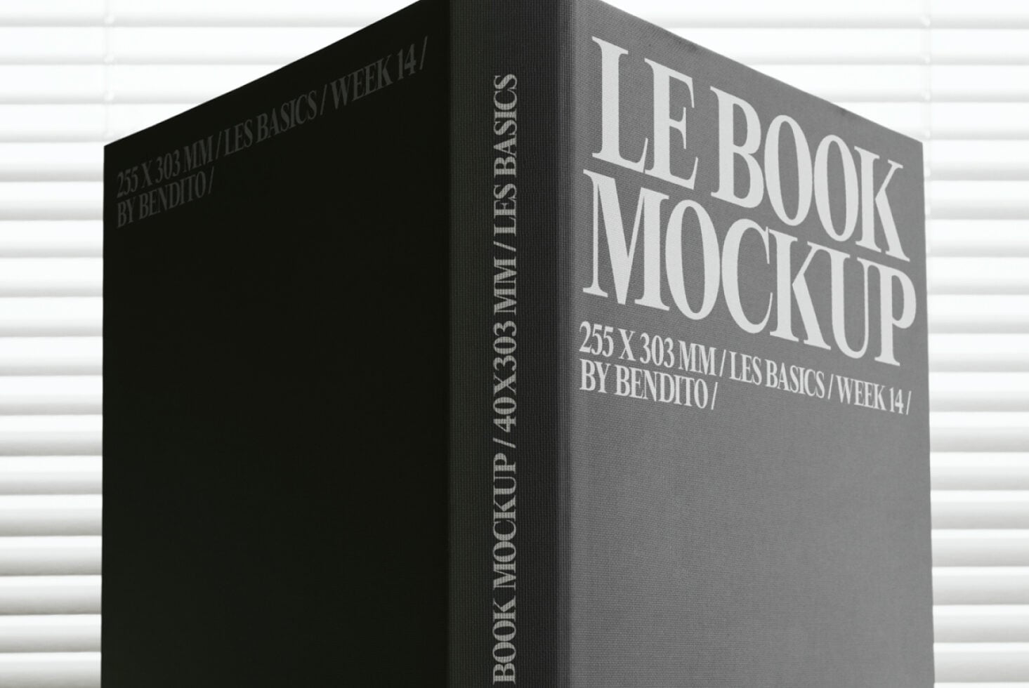 Gray hardback book mockup with white lettering on dark textured background