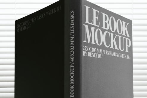 Gray hardback book mockup with white lettering on dark textured background