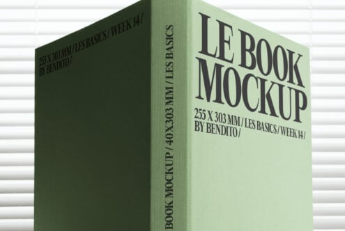 Mint green book mockup with bold serif type on light textured surface
