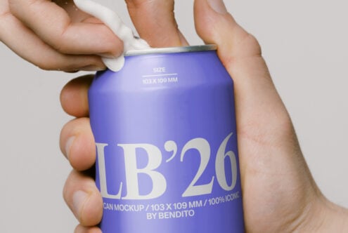 Bright blue soda can labeled LB'26 being opened by hands against white background