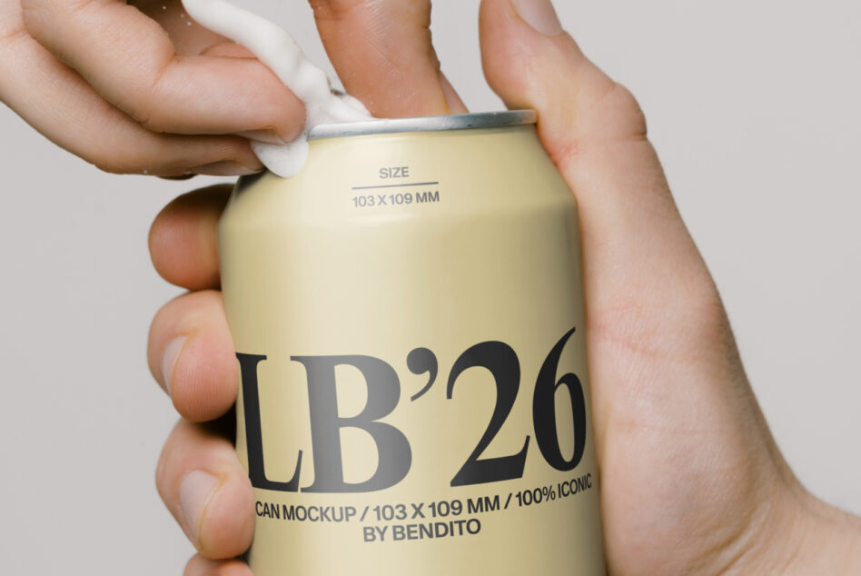 Pale yellow drink can with LB'26 logo held in someone's grip showing metallic rim