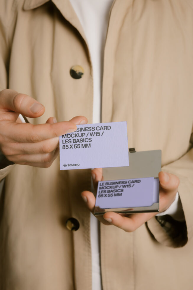 Hands displaying lavender business cards with Les Basics mockup text