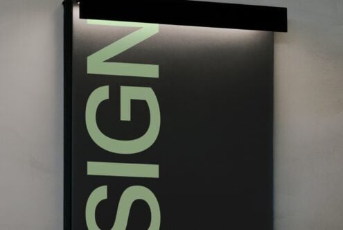 Wide neon green sign mockup with Le Siglo text glowing against dark interior space