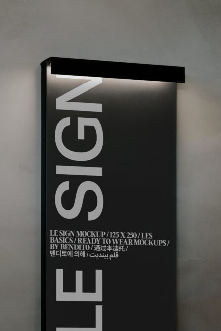 Vertical white neon sign mockup with Le Siglo text glowing against black interior