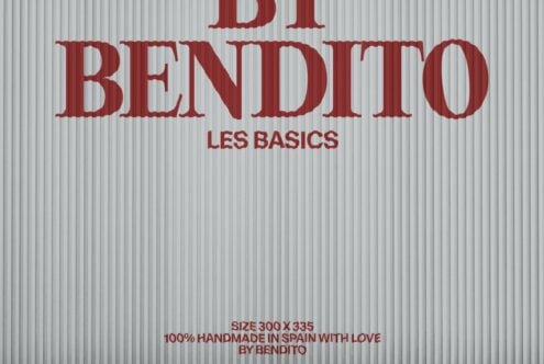 Red textured serif type saying Di Bendito Les Basics on corrugated metal backdrop