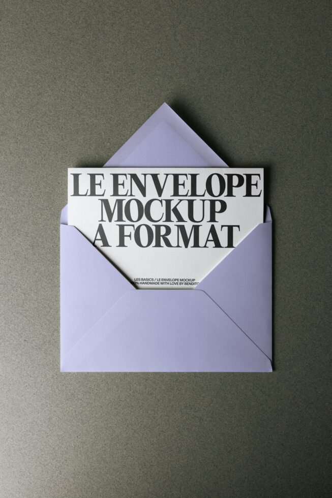 Lavender envelope mockup open on green surface showing card inside