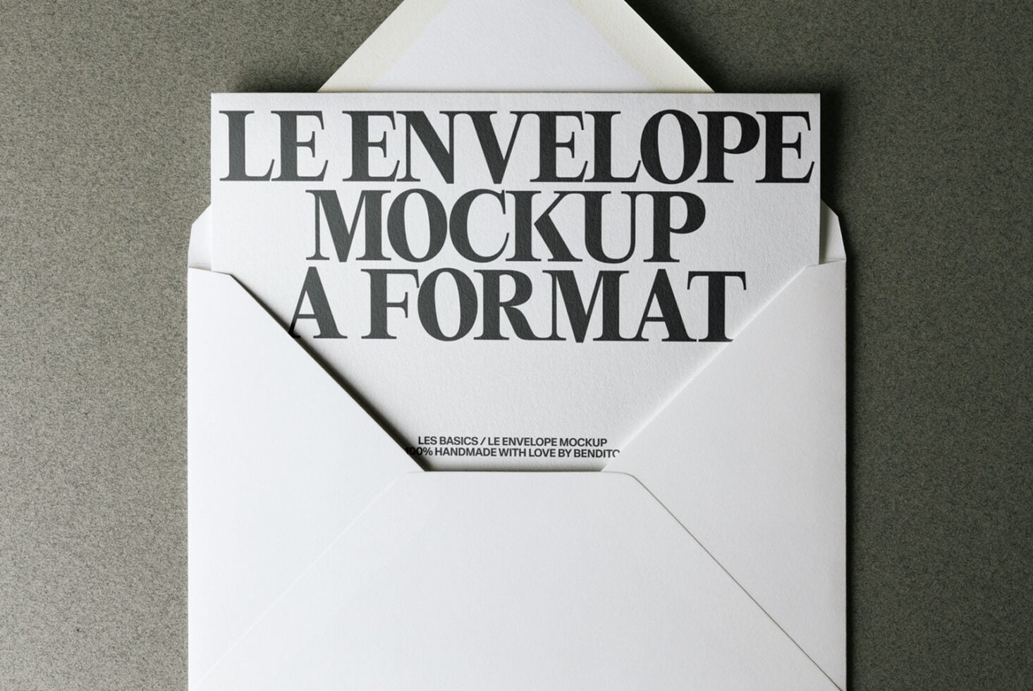 Cream envelope mockup spread flat showing white card with serif type