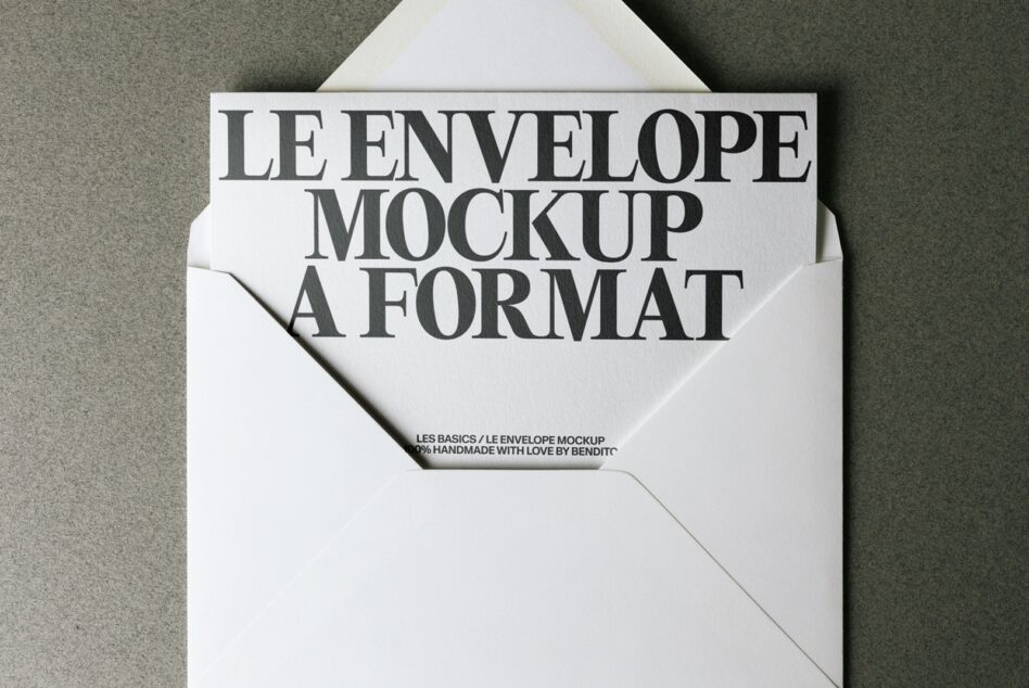 Cream envelope mockup spread flat showing white card with serif type