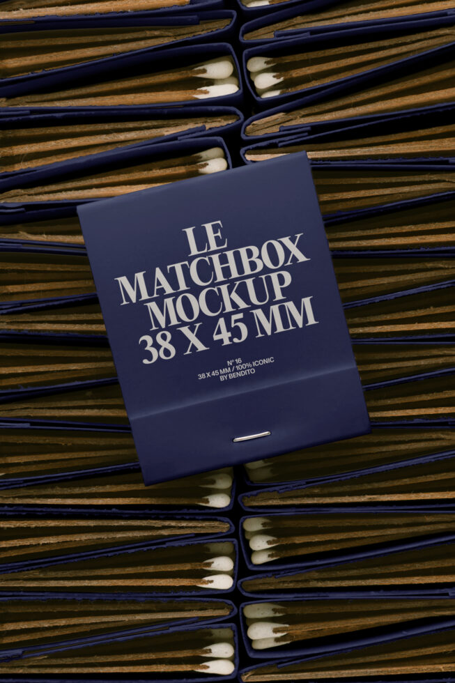 Navy matchbox mockup lying on wooden matches with blue sleeves scattered