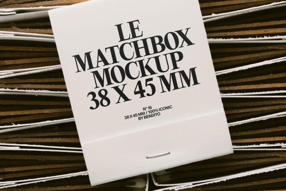 White matchbox on striped wood with black serif type layout