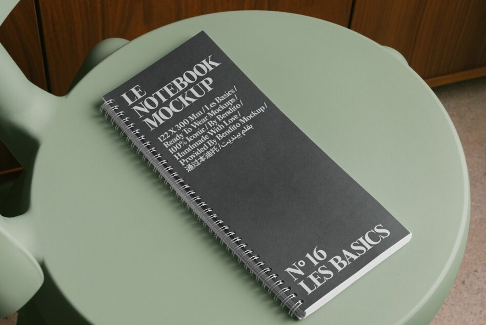 Dark cover notebook mockup flat lay on mint green round table with wood backdrop