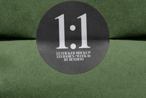 Round black sticker with large white 1.1 text on green textured background
