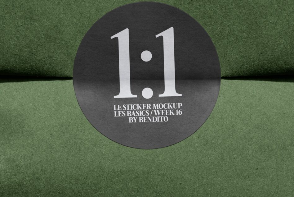 Round black sticker with large white 1.1 text on green textured background