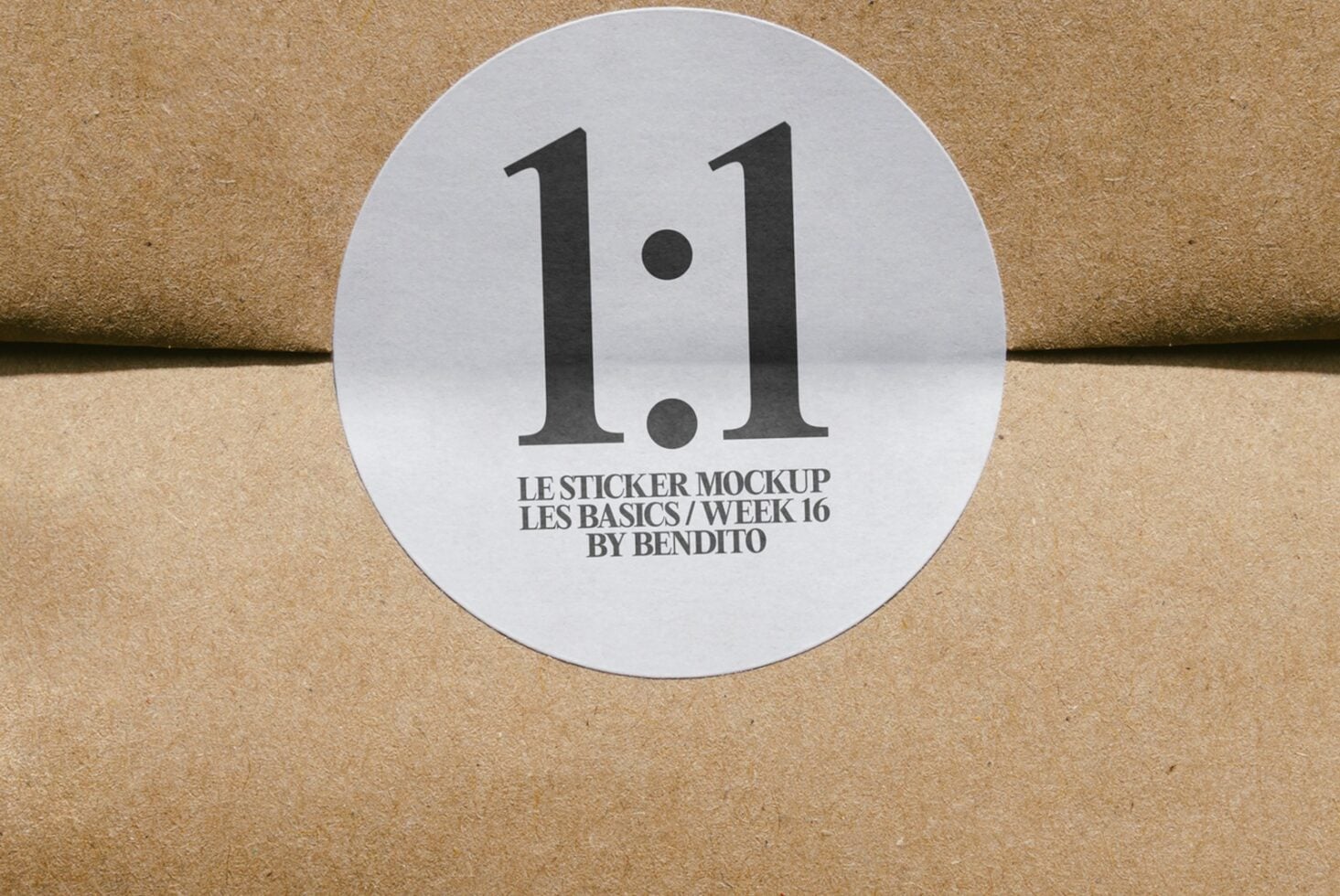 Round white sticker with bold black 1.1 on cork texture surface