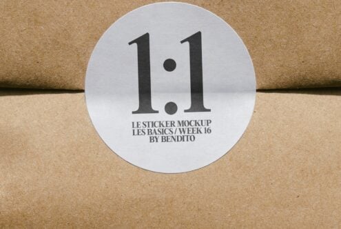 Round white sticker with bold black 1.1 on cork texture surface