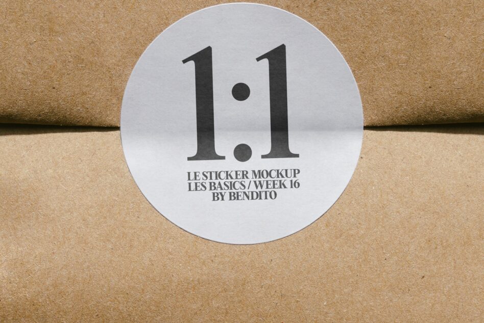 Round white sticker with bold black 1.1 on cork texture surface