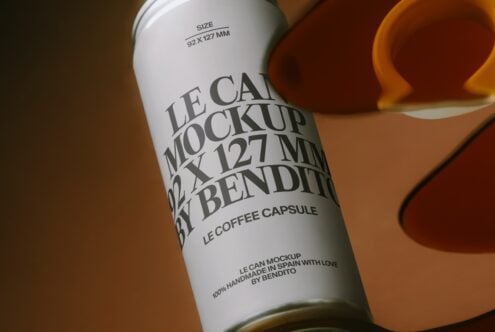 Cream coffee capsule can mockup on warm brown background detail view of label