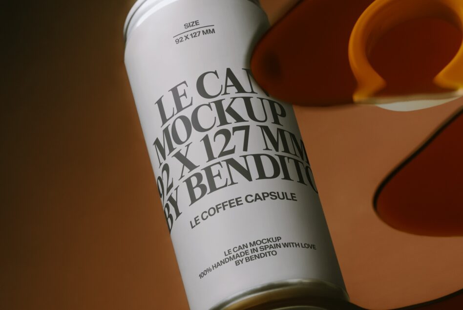 Cream coffee capsule can mockup on warm brown background detail view of label