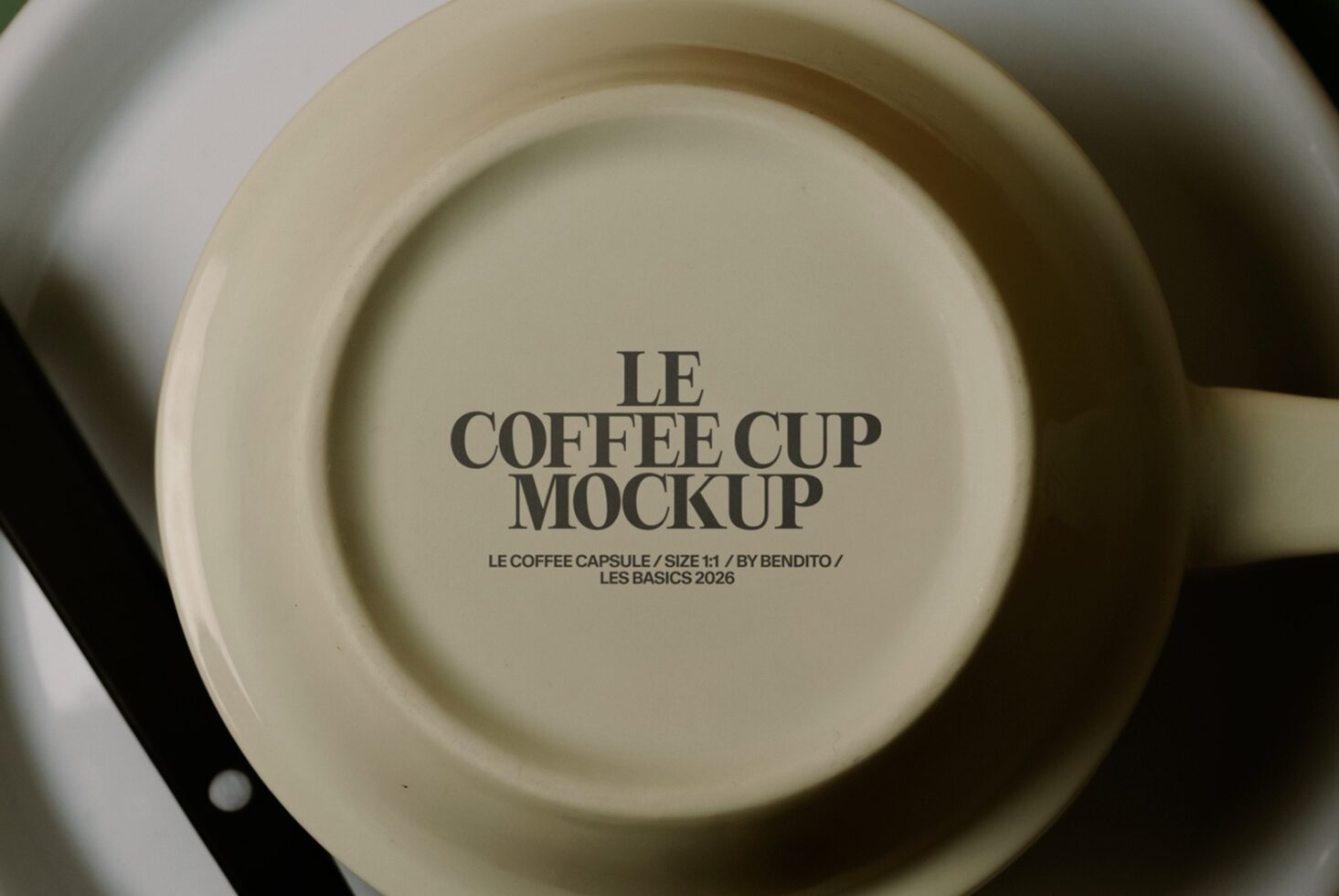 Flat lay of cream cup in saucer showing Le Coffee Cup Mockup text