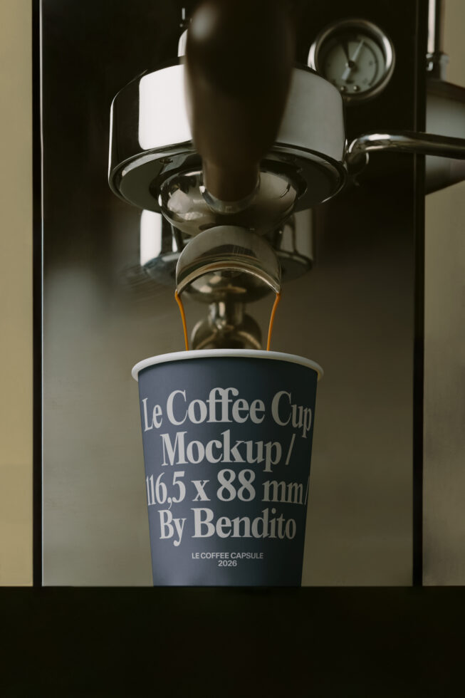 Espresso machine pouring shot into dark navy cup with white text label