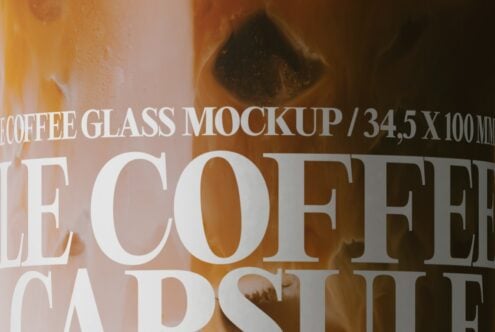 Close-up of coffee glass with bold white text overlay on warm brown background