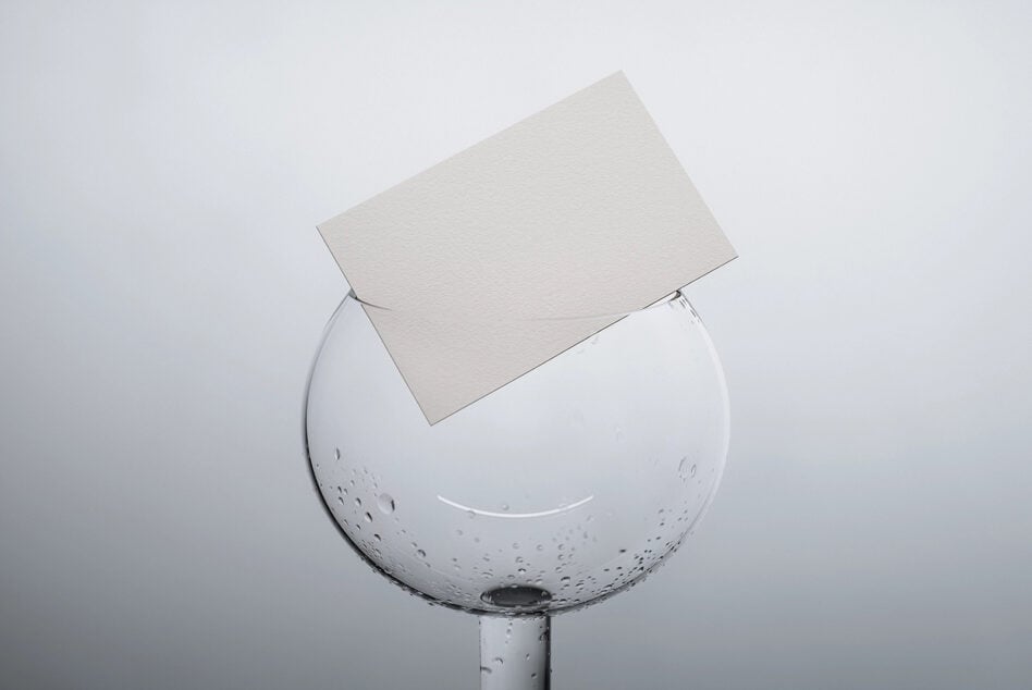 Clean business card template displayed on dewy glass sphere product shot