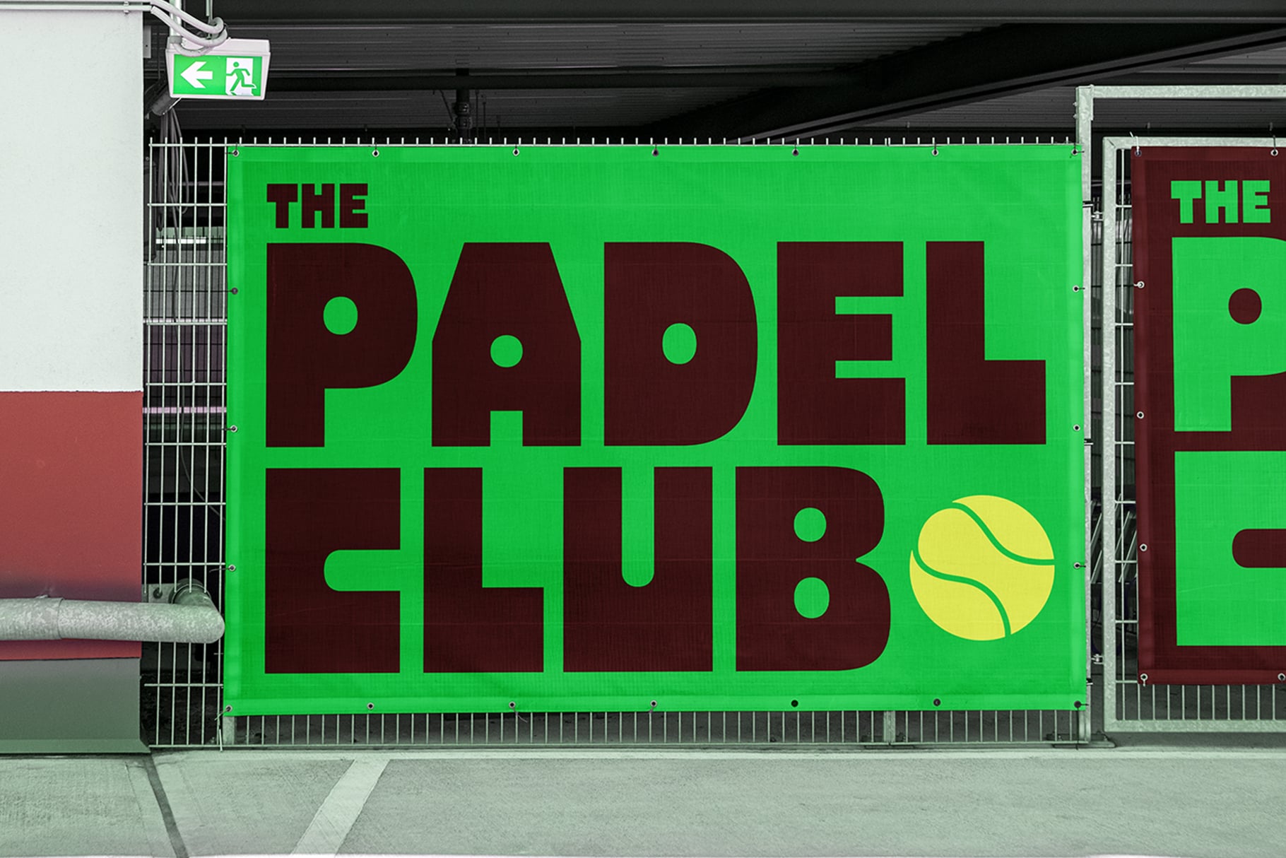 Outdoor green billboard with The Padel Club tennis ball graphic in dark red type
