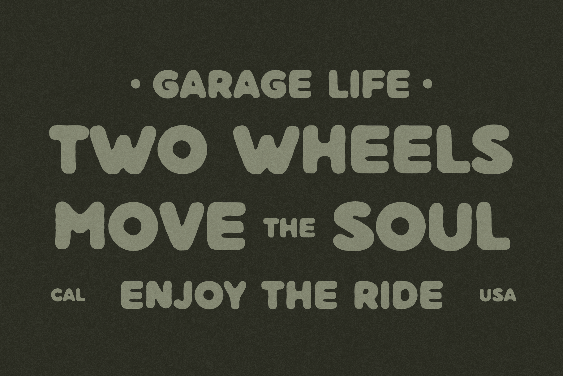 Garage Life motorcycle text in sage green on dark background with Cal USA badges