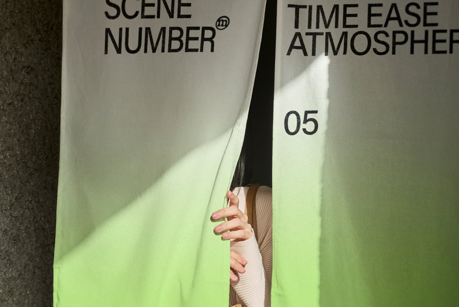 Close up of white clapper board text between two people's hands outdoors