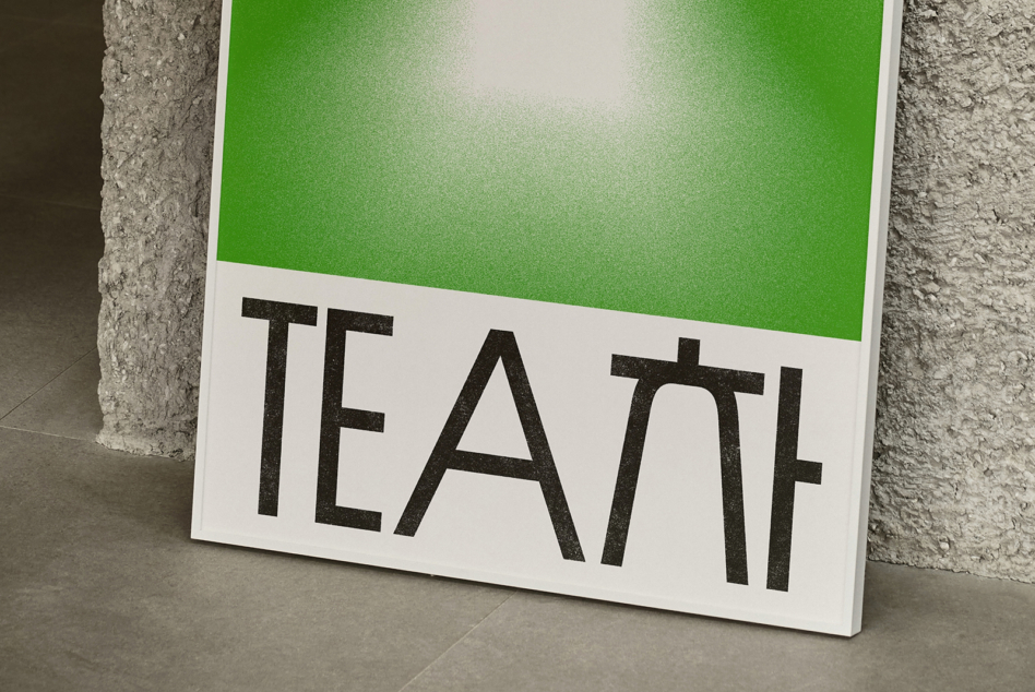 Propped white poster with bold black text on concrete surface corner view