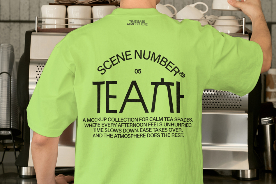 Person wearing lime tee with Scene Number 05 Tea mockup in kitchen setting