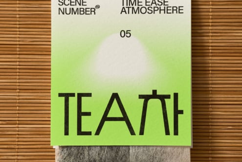 Lime gradient tea package on wooden background with integrated tea bag wrapper