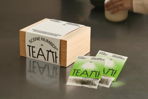 Tea packaging mockup includes wood box, metal canister, tea bag wrappers bundle