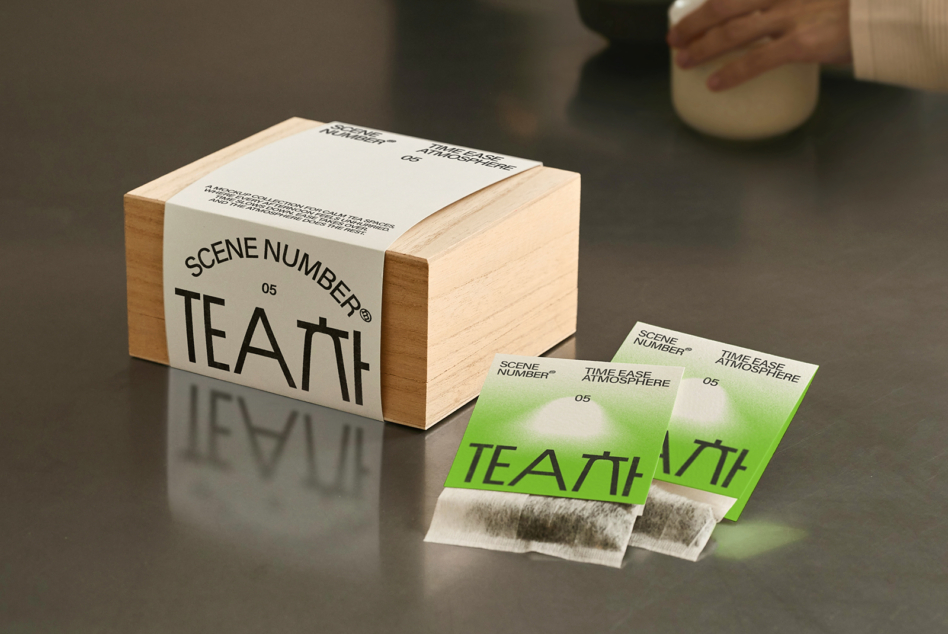 Tea packaging mockup includes wood box, metal canister, tea bag wrappers bundle