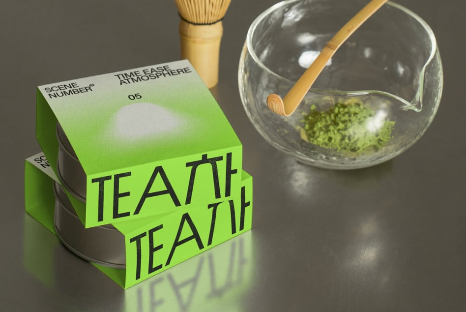 White box labeled tea with matcha whisk, wooden bowl, glass cup holding green powder