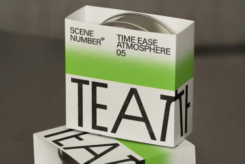 White tea box with green gradient stripe, matching product lid visible