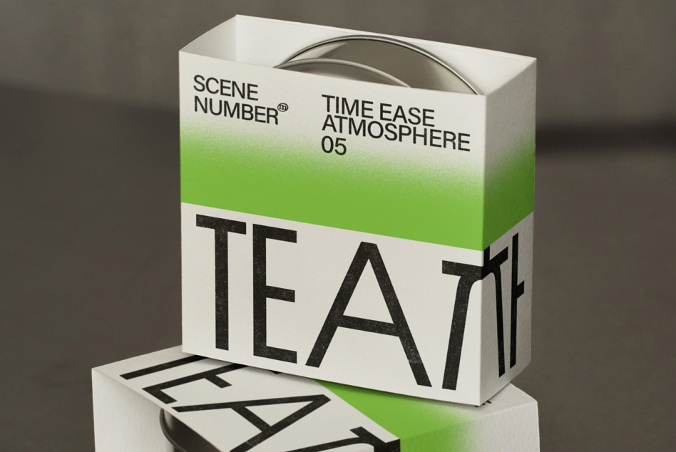 White tea box with green gradient stripe, matching product lid visible