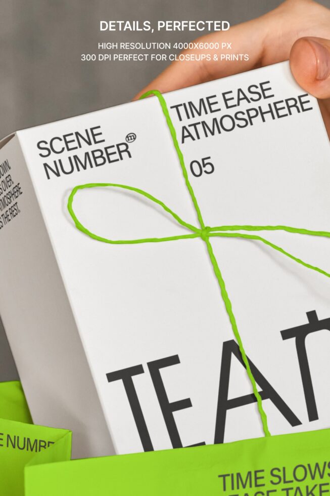Detailed macro shot of tea package with green twine bow showing typography on white card